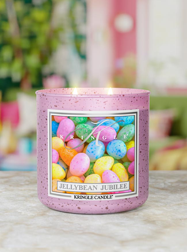 Kringle Candle Jellybean Jubilee candle on a table with a blurred background