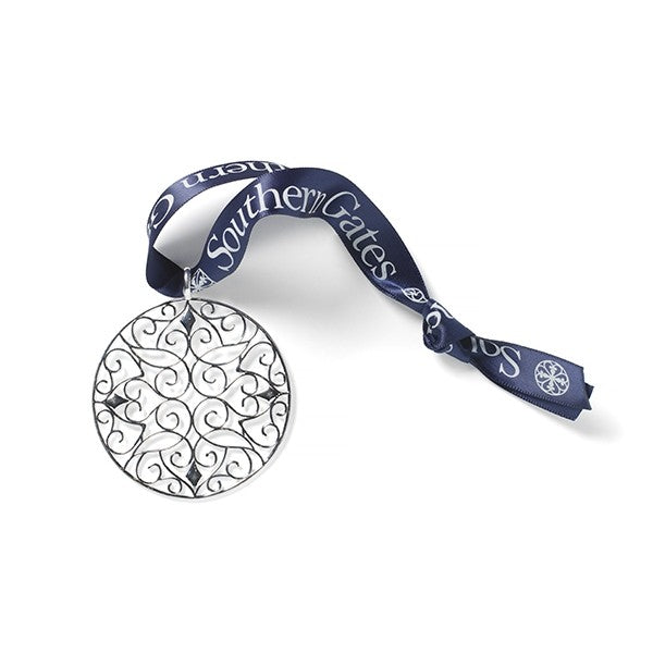 Southern Gates® 2022 Holiday Classic Scroll Ornament Holiday Series Filigree Classic Scroll Ornament A holiday collectable inspired by 18th and 19th century wrought iron gates throughout the South. Sterling silver plated Includes collectors box and signature Southern Gates blue ribbon. Ornament size: 60mm