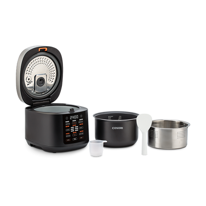 Cosori Rice Cooker displayed with all included accessories: inner pot, steam basket, paddle, and cup.
