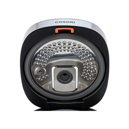 Close-up view of the detachable inner lid inside the Cosori Rice Cooker.