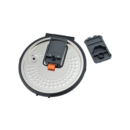 Disassembled steam vent cap components from the Cosori Rice Cooker inner lid for easy cleaning.