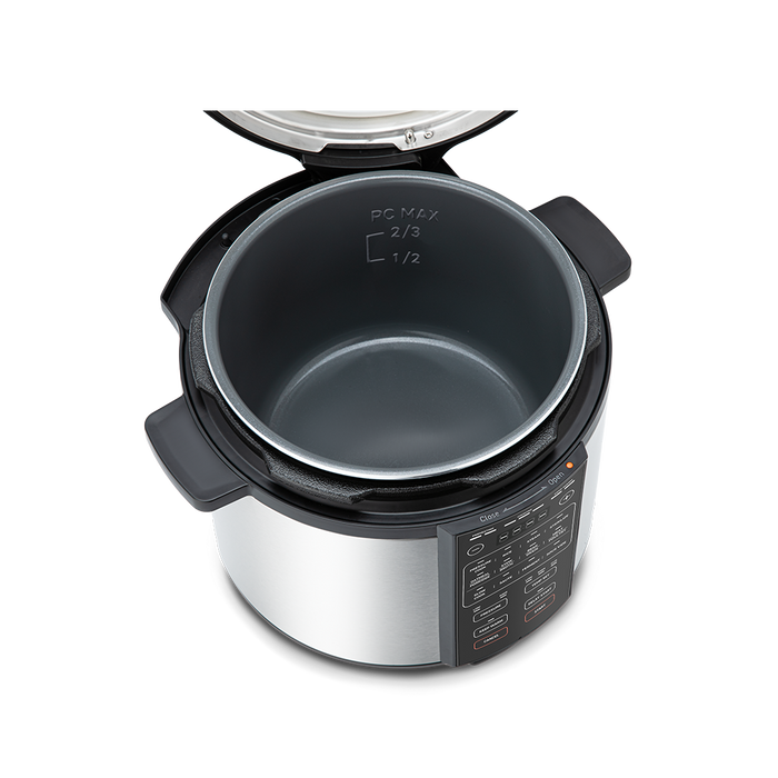 Top-down view into the open 6-quart pressure cooker pot, showing the nonstick interior coating