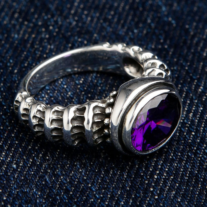 Amethyst Sterling Silver Men's Ring on Denim Background