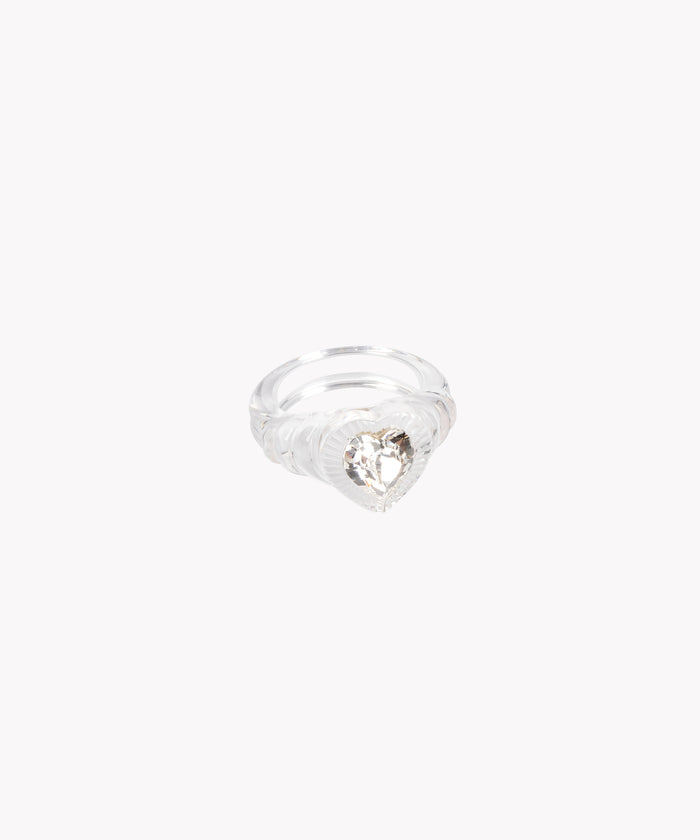 The WALD Berlin Lover Transparent Ring showcases a large, heart-shaped Swarovski stone at its center, presented on a plain white background.