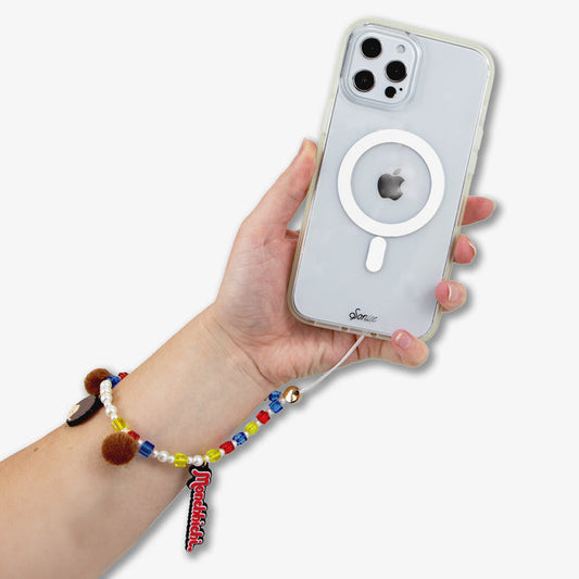Close-up of beaded wristlet with Monchhichi charms showing multicolor beads and pom-poms attached to clear Sonix phone case
