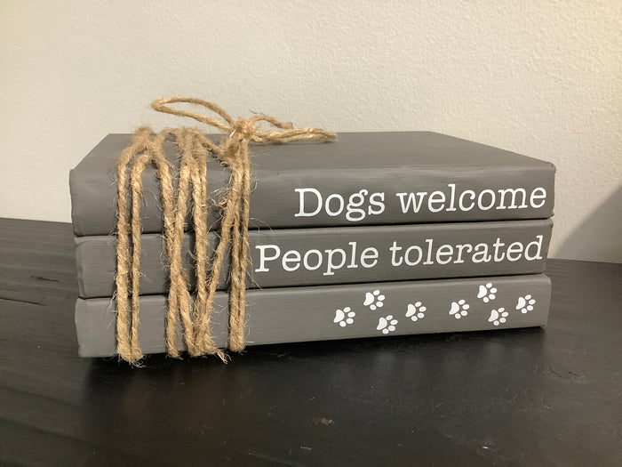 Book stack dogs welcome
