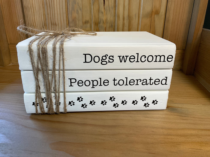 Book stack dogs welcome
