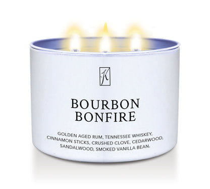 Candle in a white container labeled 'Bourbon Bonfire' with flames on a white background