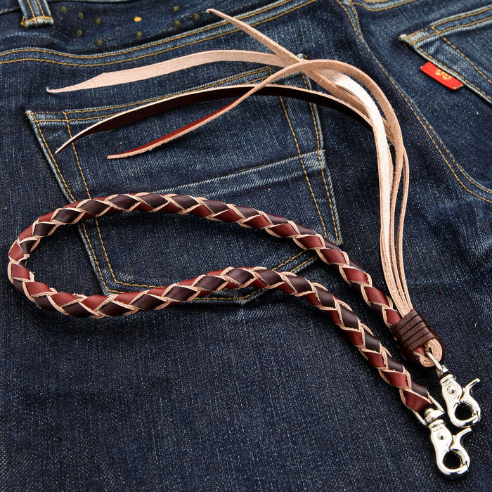 An angled view of the two-tone leather wallet chain, showing its 23.5-inch length against a denim background.