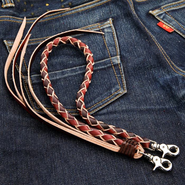 A close-up of the long leather braid of the biker wallet chain, showing the black and brown two-tone zigzag pattern.