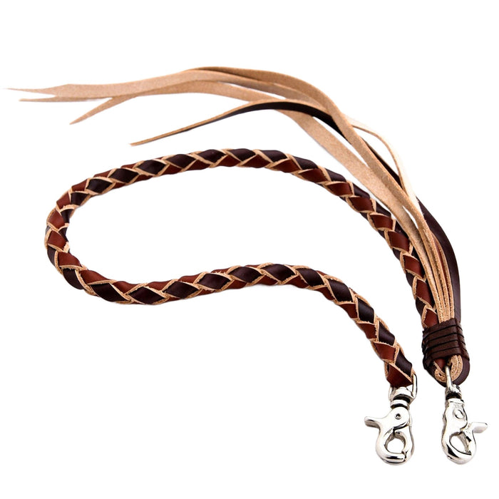 Studio shot of the handcrafted braided leather wallet chain in black and brown, showing the leather tassels and double lobster clips.