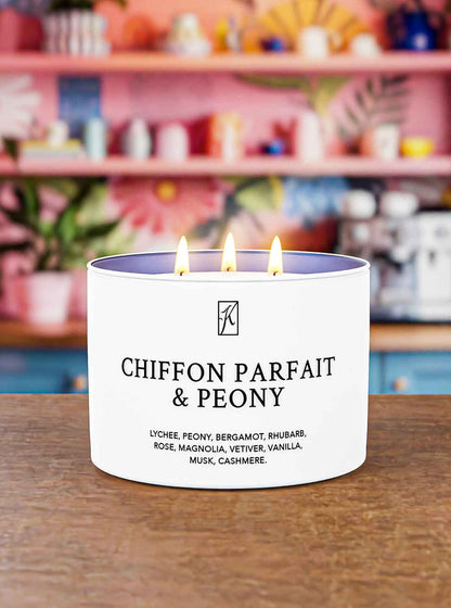 Candle labeled 'Chiffon Parfait & Peony' with a blurred store background