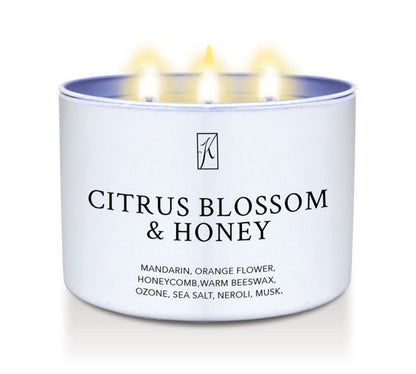 Citrus Blossom & Honey scented candle in a white tin container.