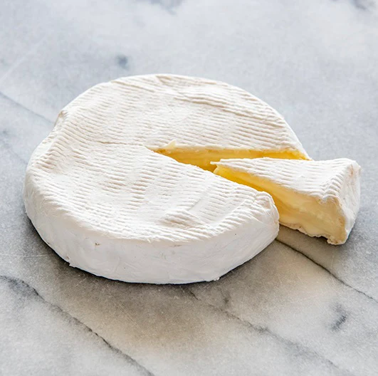 Lira Rossa artisanal cheese wheel with a slice cut, made from pasteurized cow's milk, from Moulton, Texas.