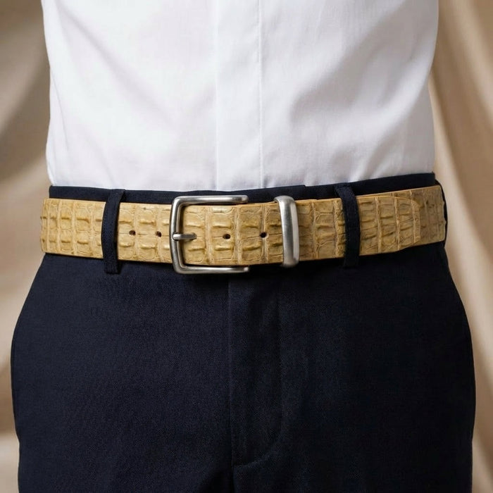 Men's cream crocodile leather belt styled with navy dress trousers and white shirt
