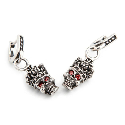 Crown skull dangle earrings in oxidized .925 sterling silver with red garnet eyes, angled front pair view