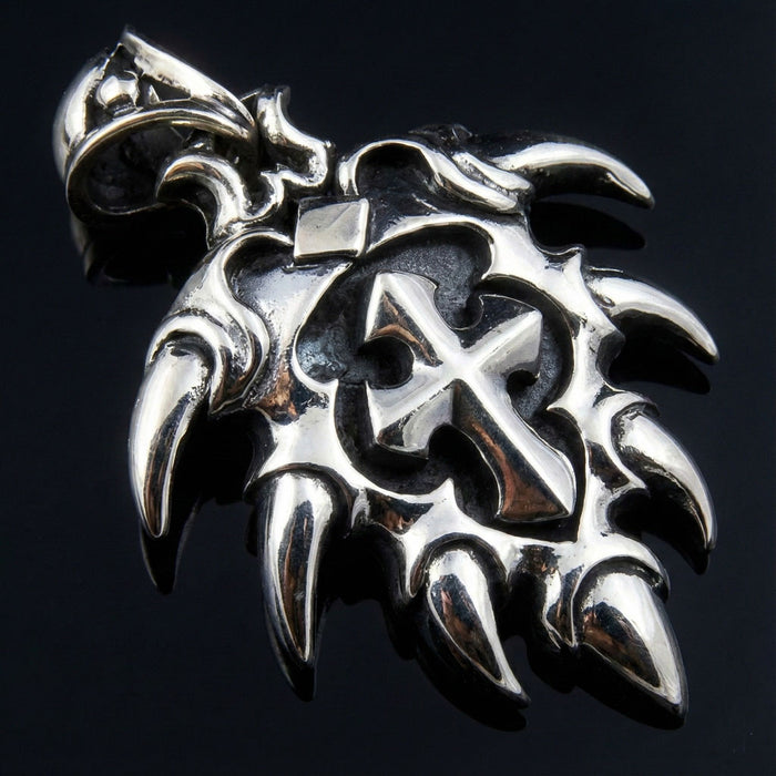 Angled view of Ethnic Spike Sterling Silver Cross Pendant showing tribal details