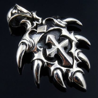 Angled view of Ethnic Spike Sterling Silver Cross Pendant showing tribal details