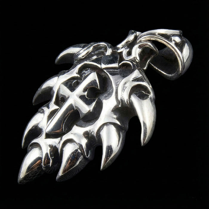 Side profile of silver cross pendant highlighting the heavy bail loop and hallmark