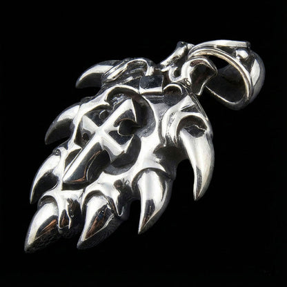 Side profile of silver cross pendant highlighting the heavy bail loop and hallmark