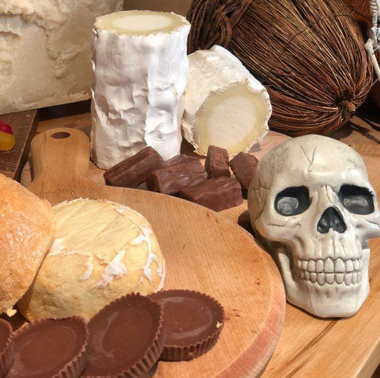 image of a skull with products from Halloween candy and cheese pairing