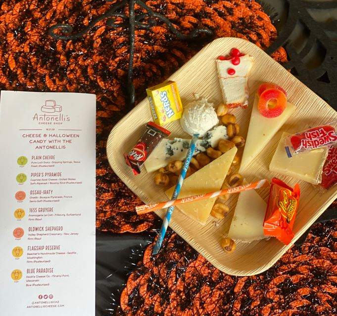 image of past halloween candy and cheese pairing plate with multiple cheeses and multiple pairings