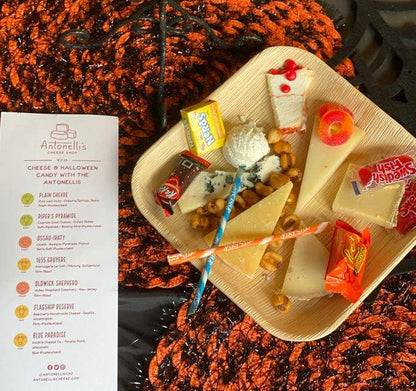 image of past halloween candy and cheese pairing plate with multiple cheeses and multiple pairings