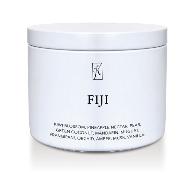White tin container with 'FIJI' branding and fragrance description on a white background by ringle Candle.