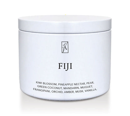 White tin container with 'FIJI' branding and fragrance description on a white background by ringle Candle.