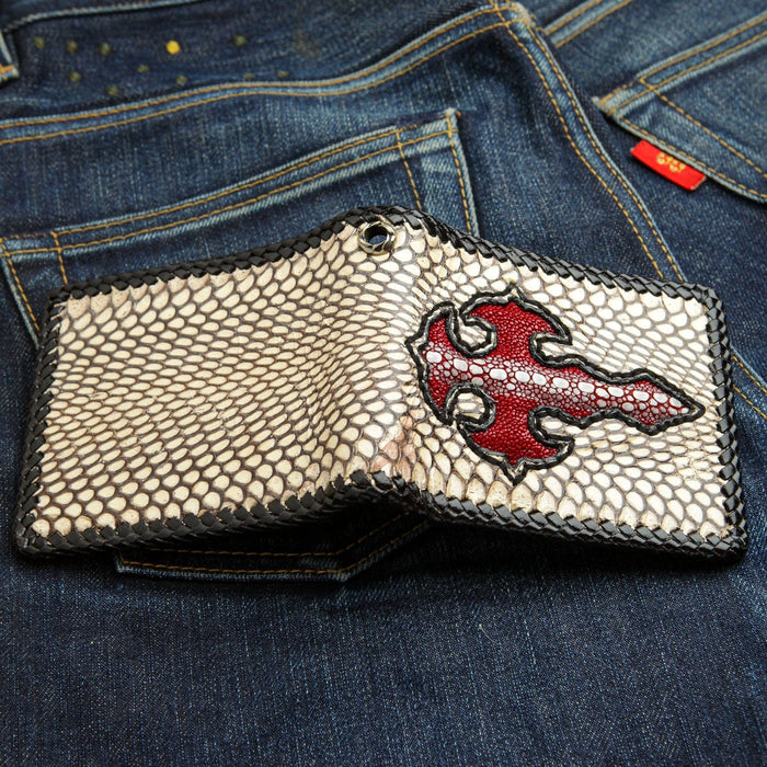 A men's wallet featuring a vibrant red stingray cross on a natural snakeskin background.