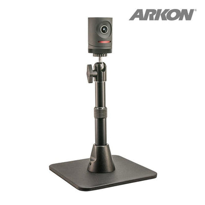 A compact black Mevo camera sits on the Height-Adjustable Camera Desk Stand (7.5 to 9.75 inches tall), shown with a square base on a white background. ARKON branding appears in the top right corner, ideal for live streaming setups.