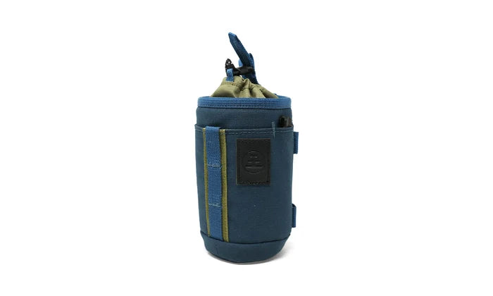 Small, versatile, and ready for more than one job, the Monocular Tube Caddy keeps your monocular protected and accessible, whether it’s slung over your shoulder, mounted to your pack, or clipped inside your car.

Featuring a drawstring cinch lid, NocLoc universal strap connectors, and rugged recycled fabric, this caddy integrates seamlessly with the NocLoc system. Bonus: it’s conveniently sized to double as a slim-can beverage holder when you’re glassing from camp or trailhead.