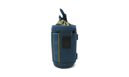 Small, versatile, and ready for more than one job, the Monocular Tube Caddy keeps your monocular protected and accessible, whether it’s slung over your shoulder, mounted to your pack, or clipped inside your car.

Featuring a drawstring cinch lid, NocLoc universal strap connectors, and rugged recycled fabric, this caddy integrates seamlessly with the NocLoc system. Bonus: it’s conveniently sized to double as a slim-can beverage holder when you’re glassing from camp or trailhead.