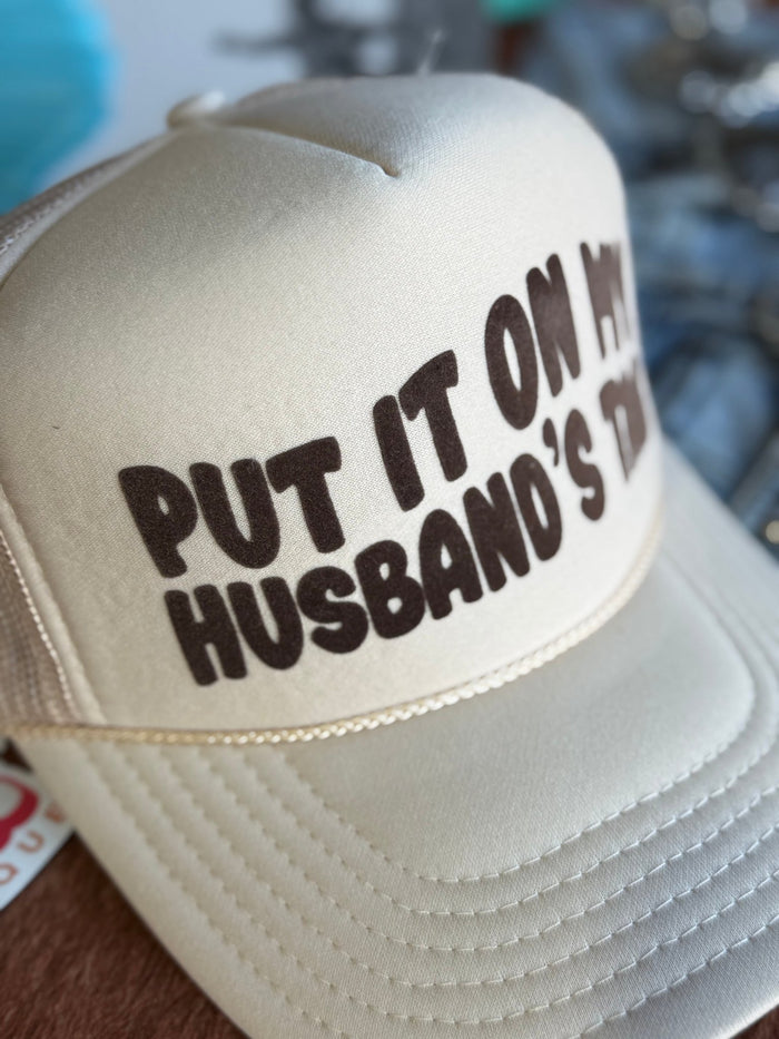 Put It On My Husband's Tab Trucker Hat