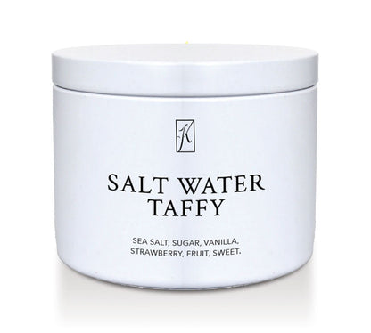 Kringle Candle Salt water taffy candle tin with a white lid on a white background