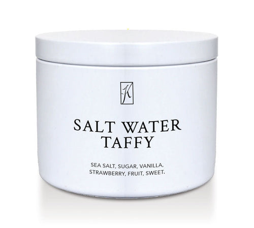 Kringle Candle Salt water taffy candle tin with a white lid on a white background