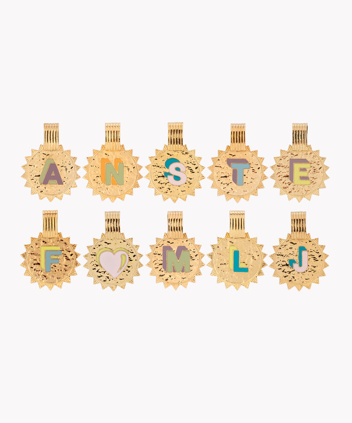 The WALD Berlin Sample saleSay My Name Gold Necklace showcases ten gold-plated sunburst charms, each with a colorful letter or heart, arranged in two rows—ideal for customizing your own initial necklace with an adjustable length.