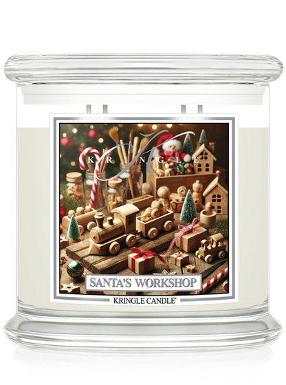 Kringle Candle’s Santa’s Workshop, featuring a festive label with wooden toys, candy canes, and holiday decor, 4-wick.