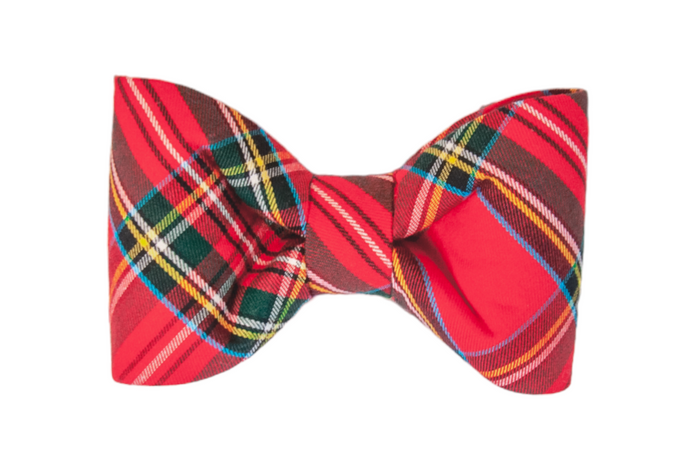 Classic dog bow tie made from bright red flannel with festive plaid stripes—designed with clean lines and a dapper silhouette for a timeless holiday look.
