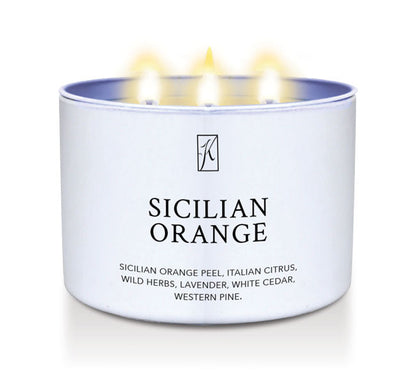 Candle in a white tin container labeled 'Sicilian Orange' on a white background