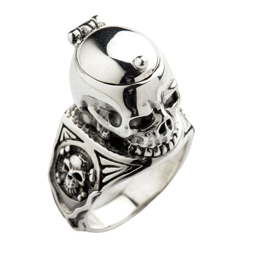 A closed view of a gothic skull locket ring, showing the intricate skull and crossbones engravings on the side.