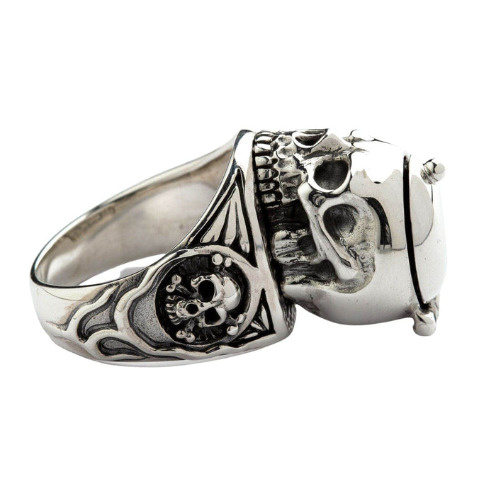 A men's secret compartment skull ring with the lid open to clearly show the small storage space inside.