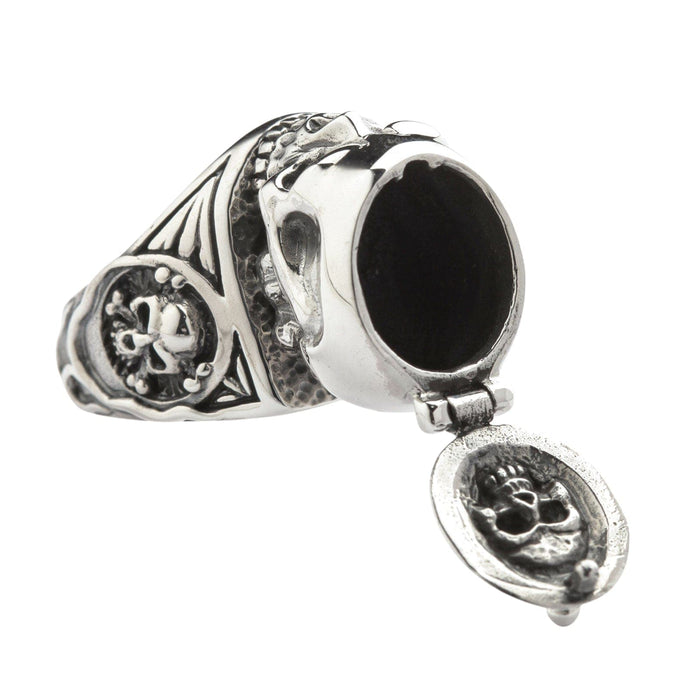 The detailed side profile of a sterling silver skull ring with a functional, sturdy hinged top mechanism.