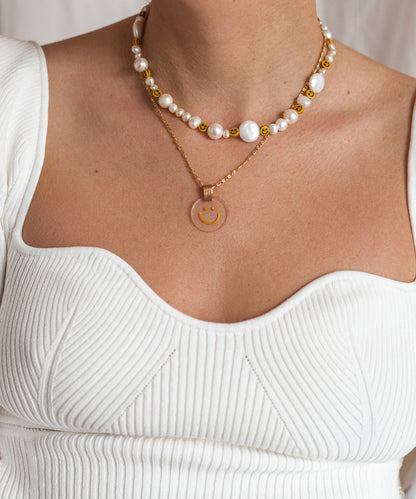 A woman wearing a WALD Berlin Smilie Dude Pearl Necklace in Germany's capital city.