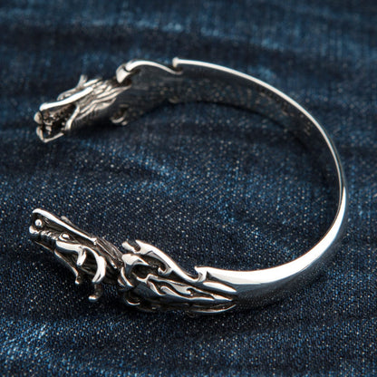 The open, adjustable cuff design of the sterling silver dragon bracelet.
