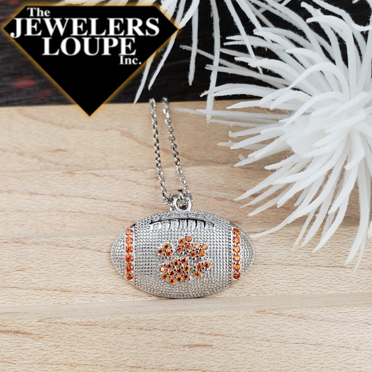 Sterling Silver Football Charm with Paw design in Orange colored cubic zirconia on an 18" Sterling Silver chain.