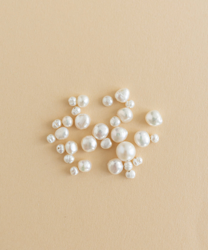 A charm-filled kit of Sweet Water Pearls from WALD World showcased on a beige background.