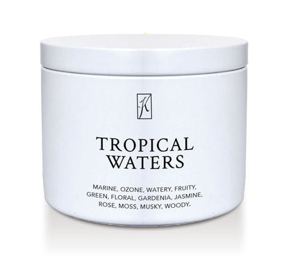 'Tropical Waters' scented candle in a tin container on a white background.