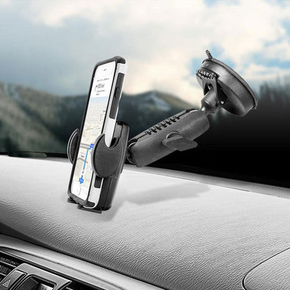 A smartphone with the Windshield Suction Phone Mount for Mega Grip™ Phone Holder displays a navigation app on the dashboard, while a blurred mountain landscape is visible through the cars windshield.