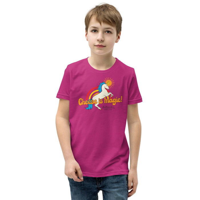 Youth wearing pink "Cheese is Magic" short sleeve t-shirt with unicorn design.